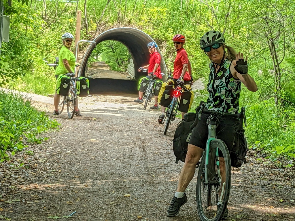 A group of people riding bikes on a trail

Description automatically generated with medium confidence
