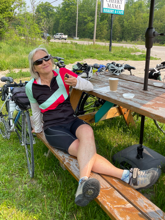 A person sitting on a picnic table

Description automatically generated with medium confidence