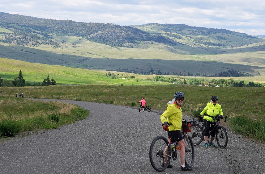 A group of people on bicycles on a road

Description automatically generated