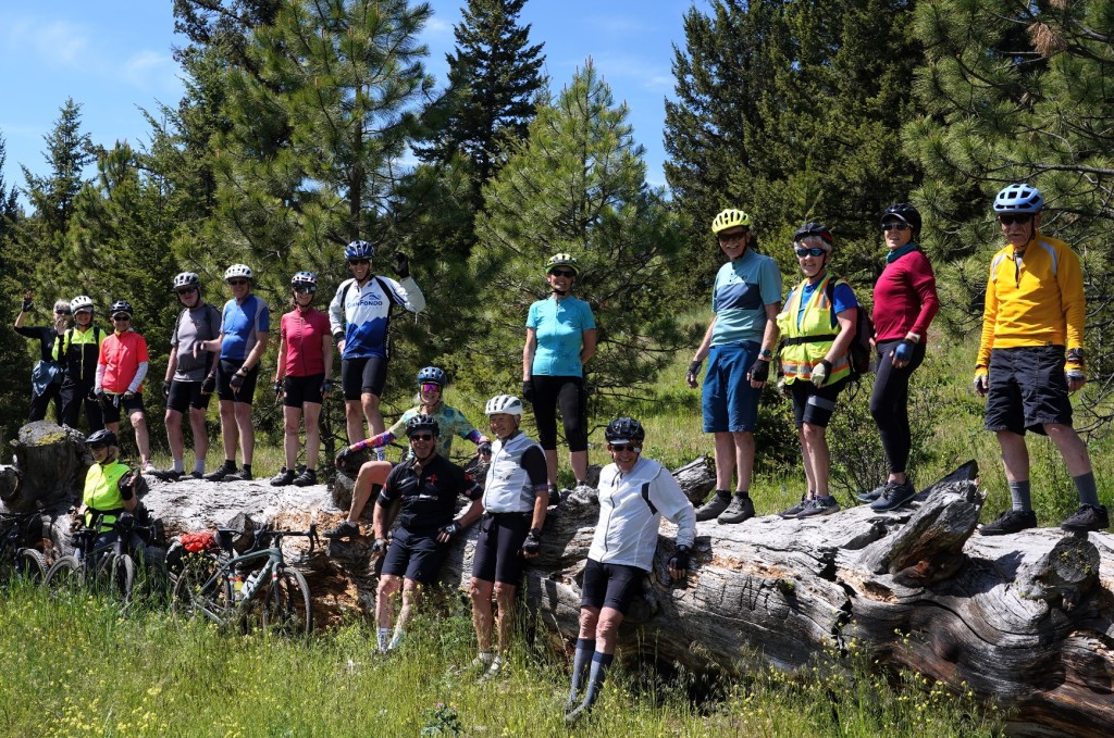 A group of people standing on a rock

Description automatically generated