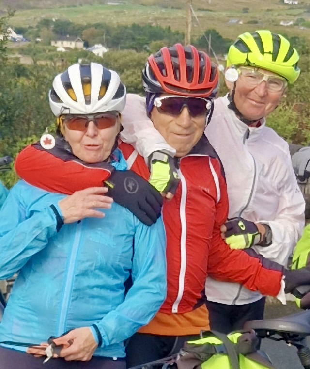 A group of people wearing helmets and standing together

Description automatically generated