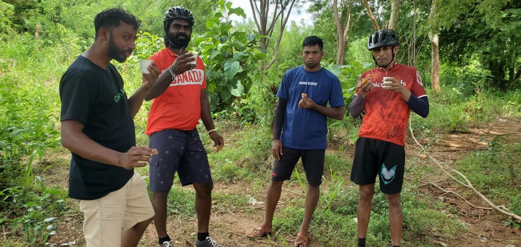 A group of men standing in a forest

Description automatically generated