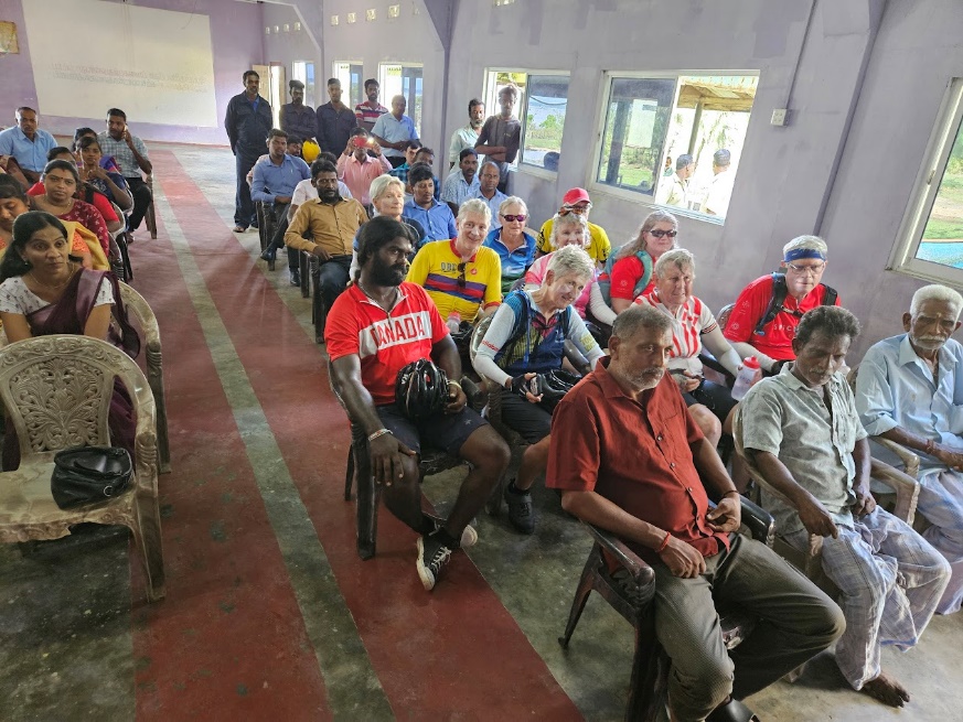 A group of people sitting in chairs

Description automatically generated